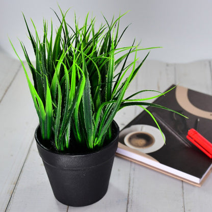 Artificial plant in a modern decorative pot.