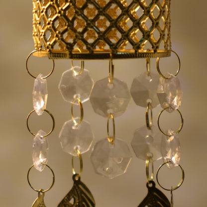 Golden jhoomer with detailed design.