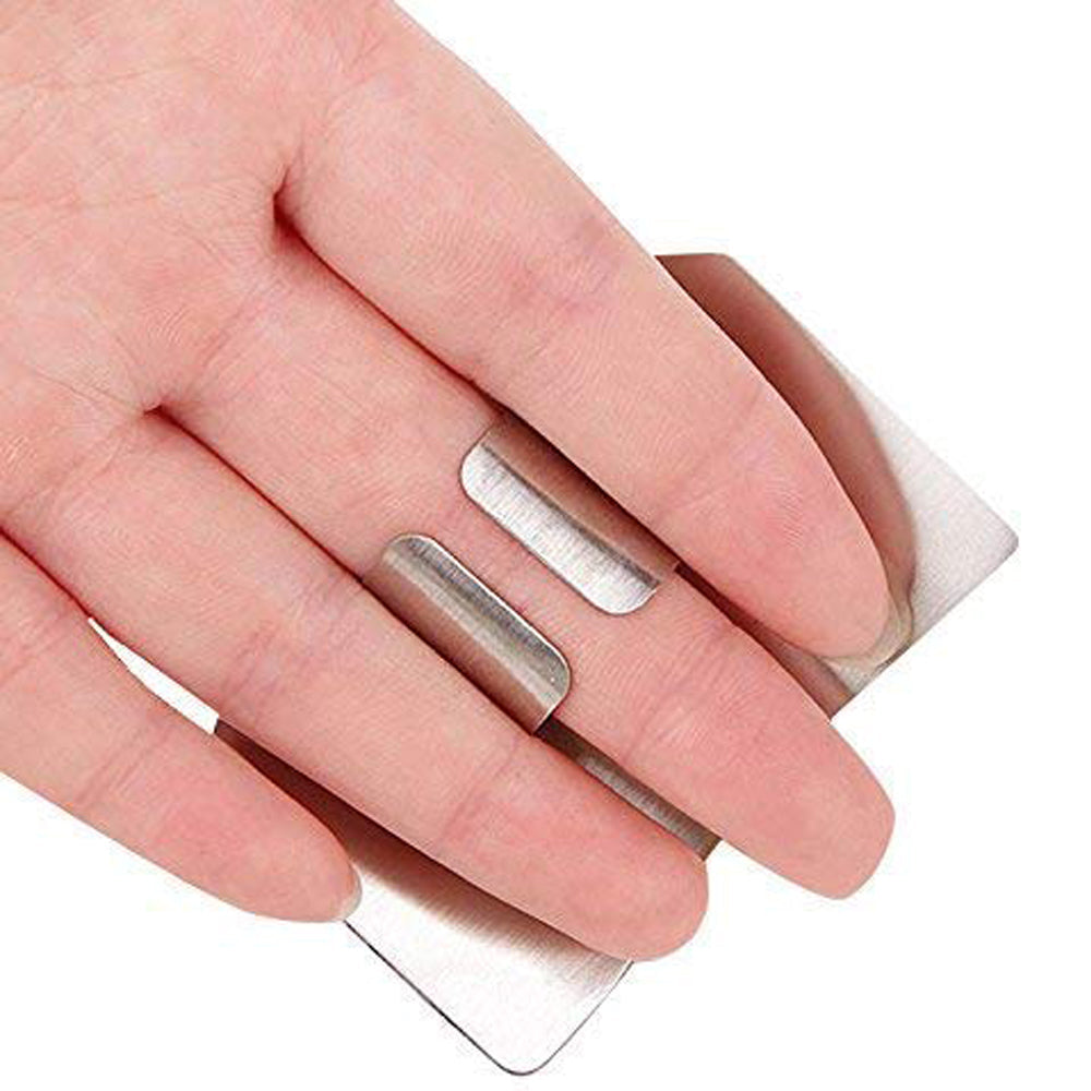 Kitchen finger guard made of stainless steel for safe chopping.