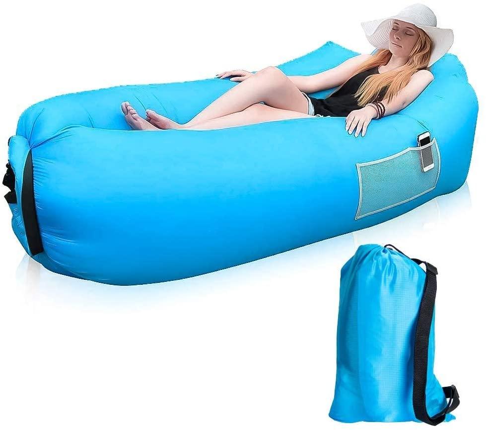 Inflatable lounger sofa in use at a campsite