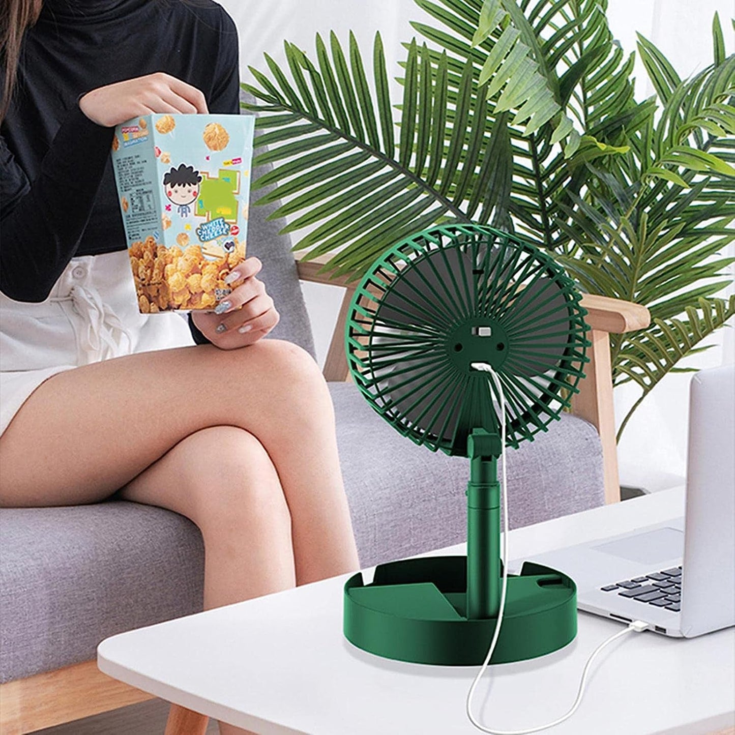 Electric fan with adjustable height and portability.