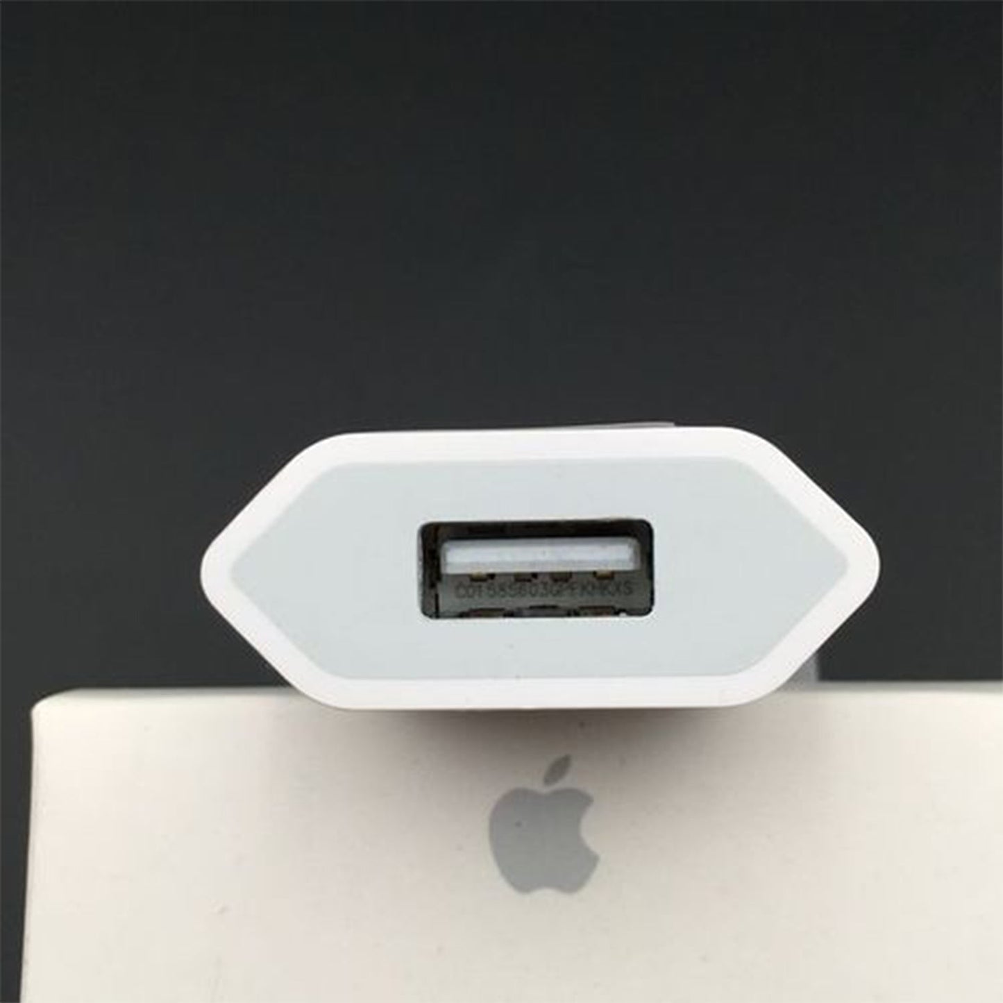 USB wall charger adaptor for iPhone and Android devices, highlighting its compact design