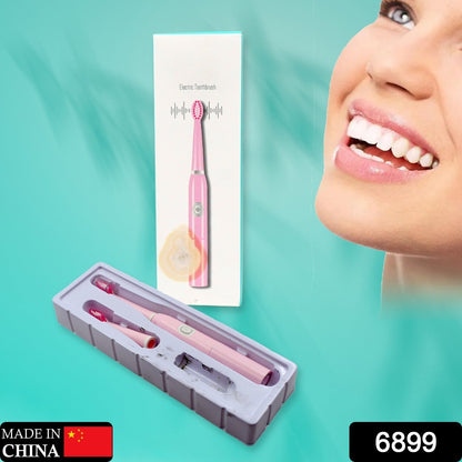 Travel electric toothbrush with battery and extra head