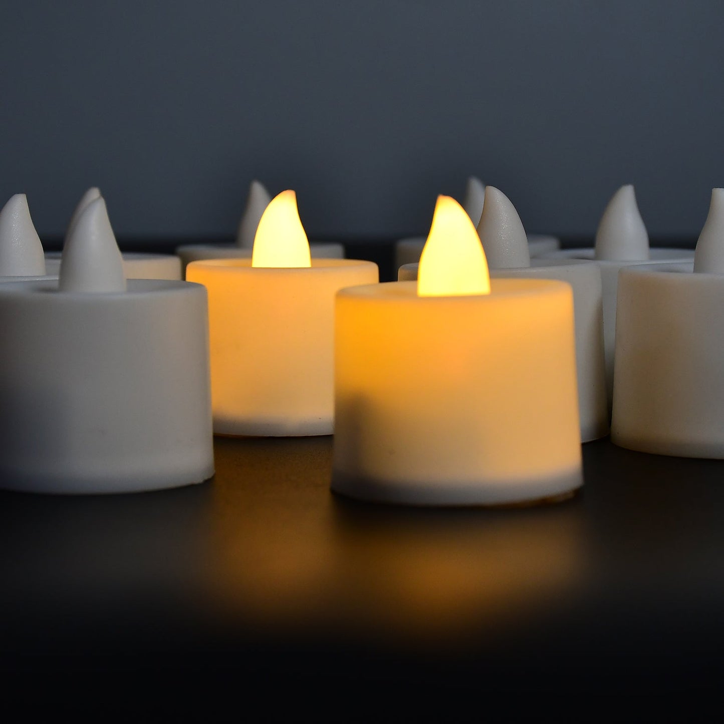 Yellow LED tealight candle set with white containers, 10 pieces.